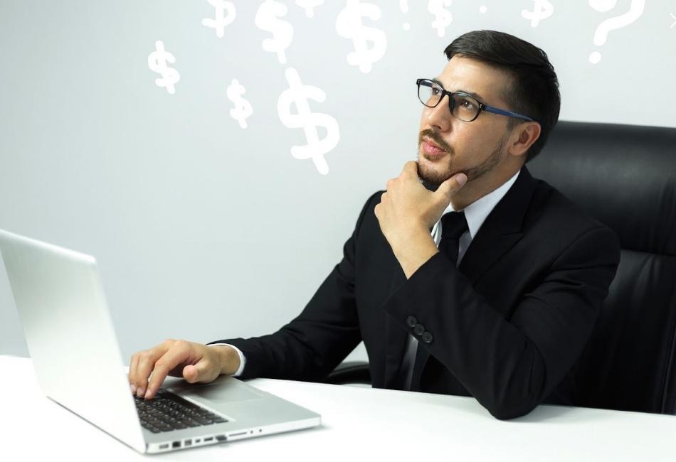Monetize Your Blog is a written on the background, is a guy sit on the desk thinking how to monetize his blog