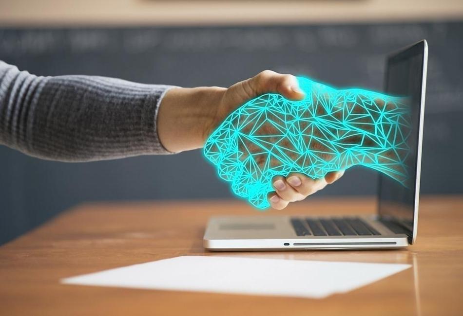 is a shacker hand between a men and a virtual pc hand